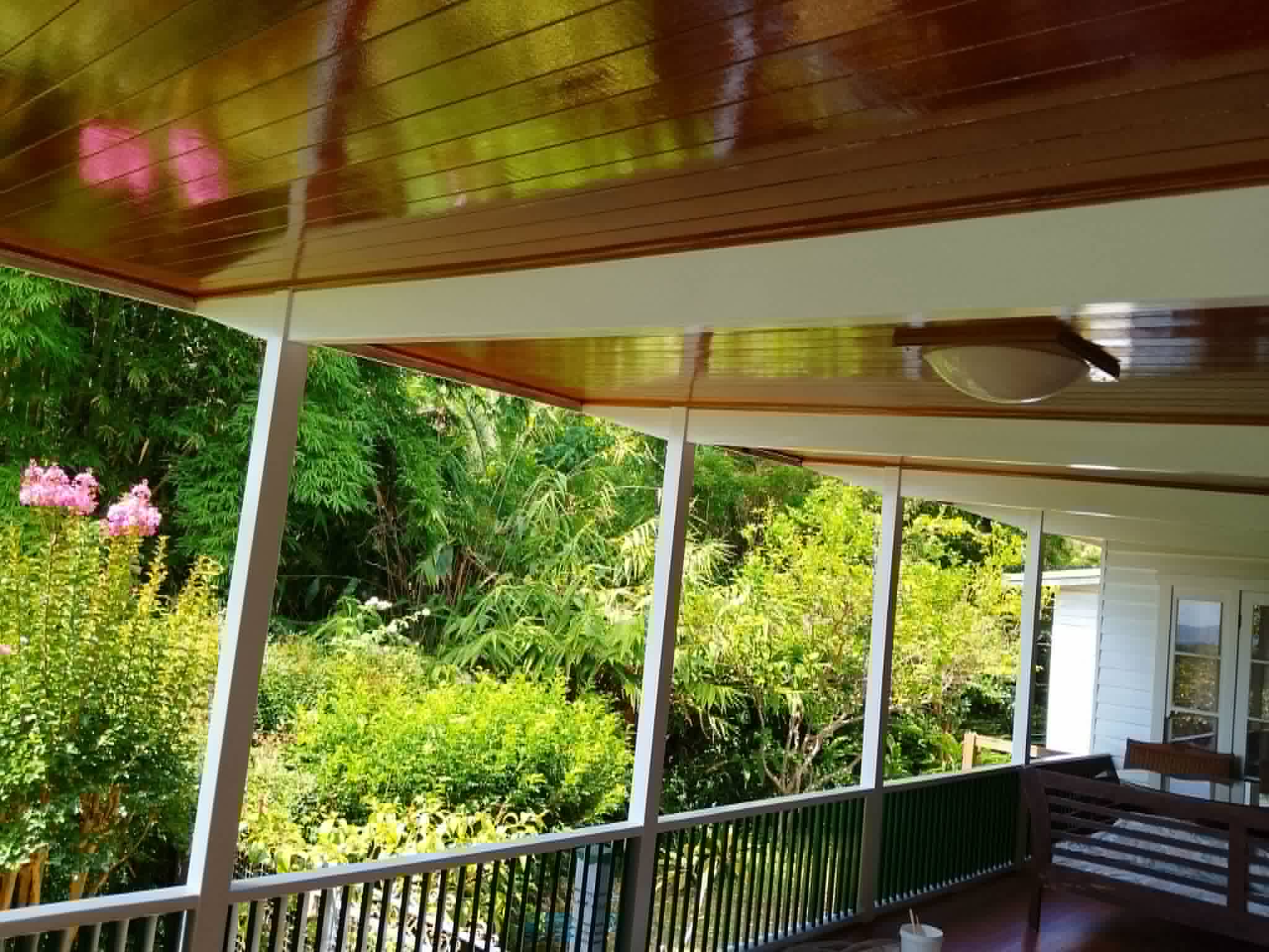 Freshly stained and sealed outdoor timber deck and handrails