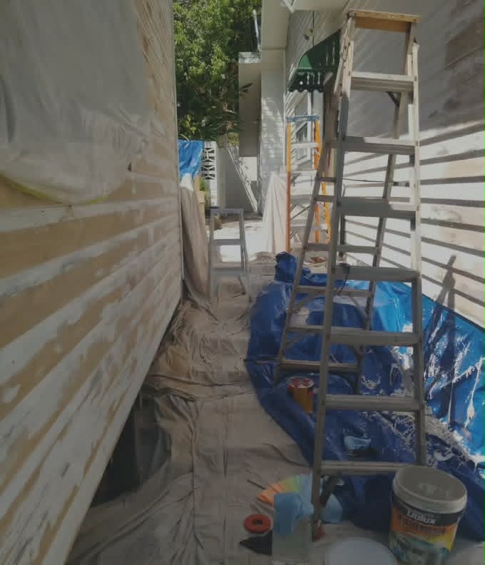 Exterior house painting on weatherboards and eaves in Northern NSW